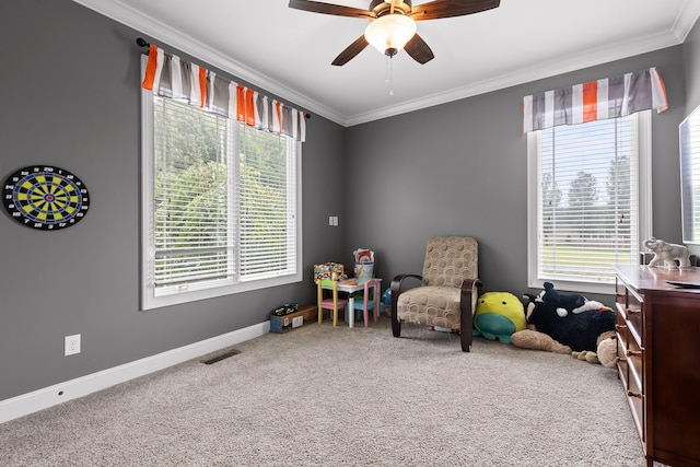 recreation room with plenty of natural light, carpet, baseboards, and ornamental molding