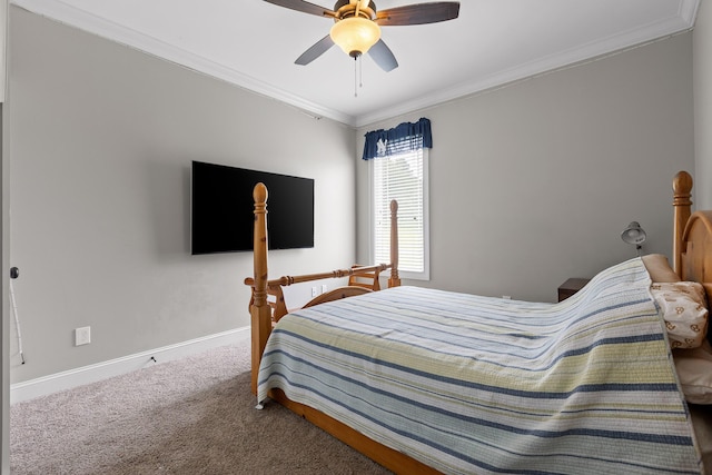 carpeted bedroom with crown molding, a ceiling fan, and baseboards