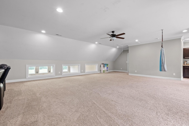 interior space with recessed lighting, baseboards, light colored carpet, and vaulted ceiling