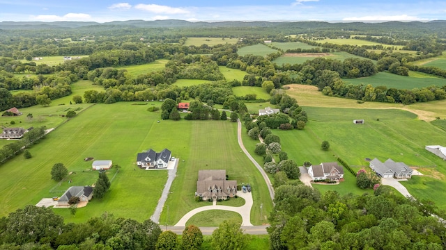 birds eye view of property with a rural view