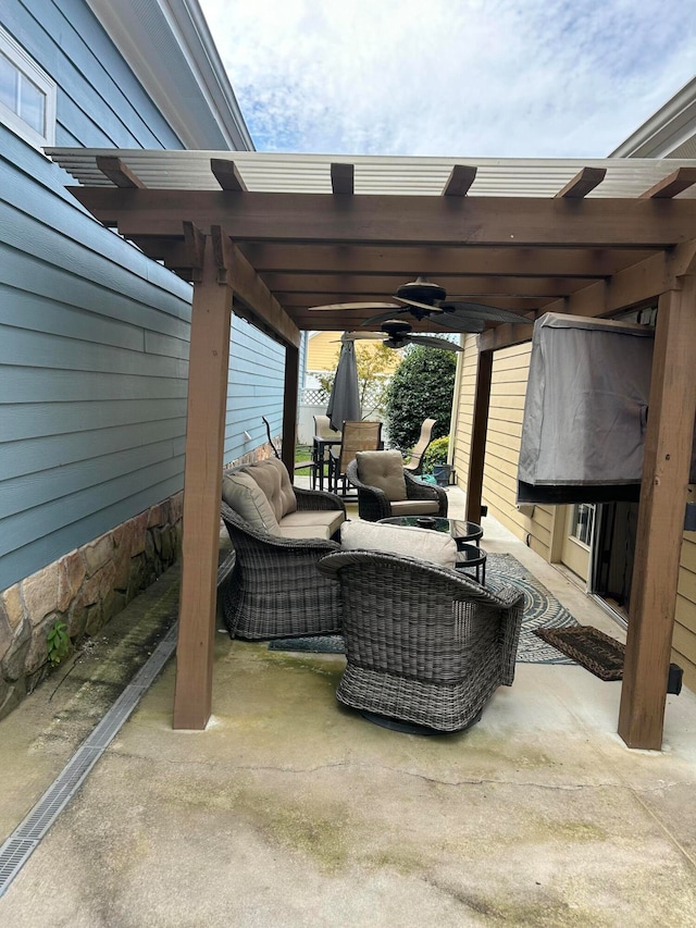 view of patio with ceiling fan, an outdoor hangout area, and a pergola