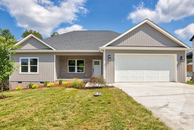 view of front of house featuring a front yard and a garage