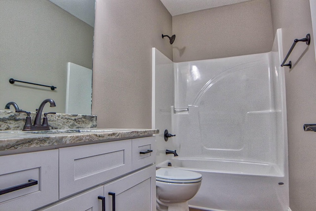 full bathroom featuring toilet,  shower combination, and vanity