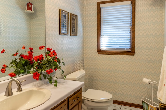 bathroom with tile patterned flooring, toilet, and vanity