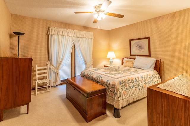 bedroom featuring ceiling fan and carpet floors