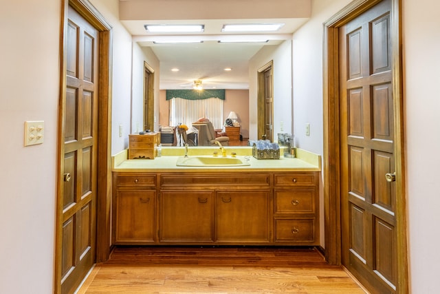 bathroom with vanity and hardwood / wood-style flooring