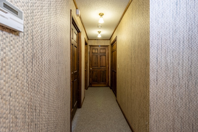 hall with light colored carpet