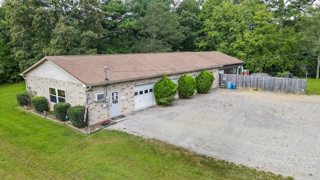 exterior space with a front yard and a garage