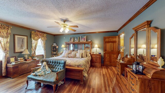 bedroom featuring ceiling fan, hardwood / wood-style floors, a textured ceiling, and ornamental molding