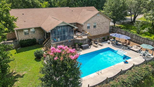 view of swimming pool featuring outdoor lounge area, central air condition unit, a lawn, and a sunroom