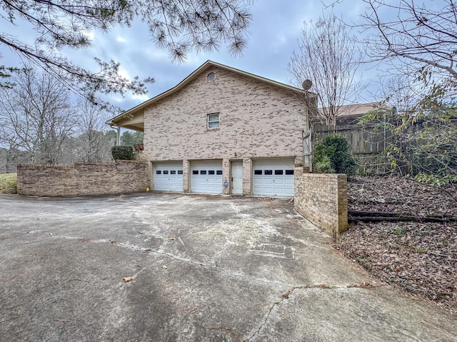 view of property exterior with a garage