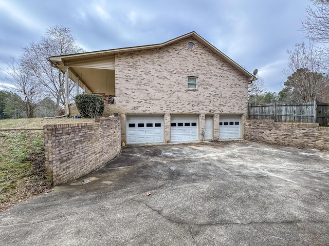 view of side of property with a garage