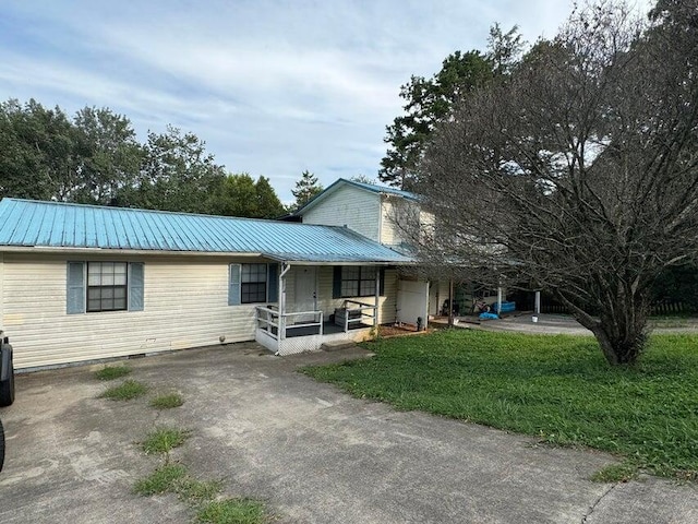 exterior space featuring a yard and a porch