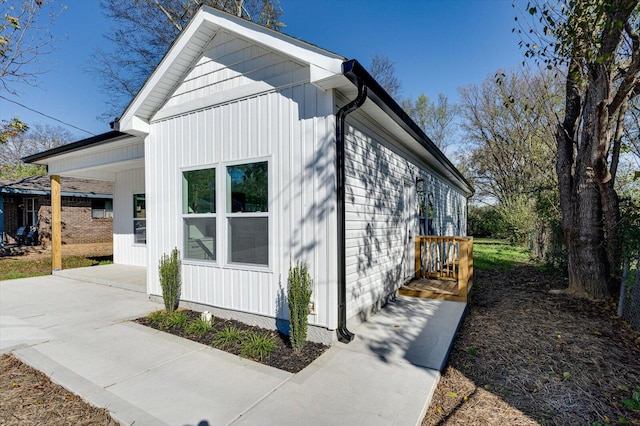 view of home's exterior with a carport