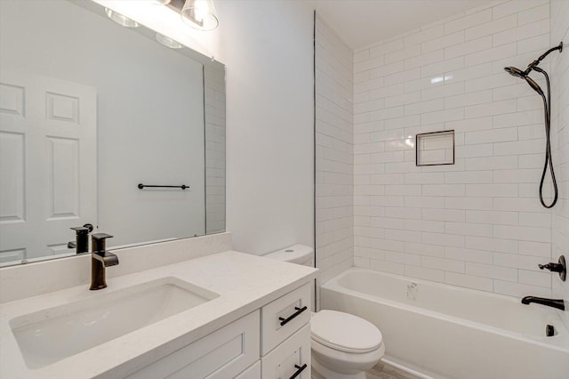 full bathroom featuring vanity, toilet, and tiled shower / bath combo