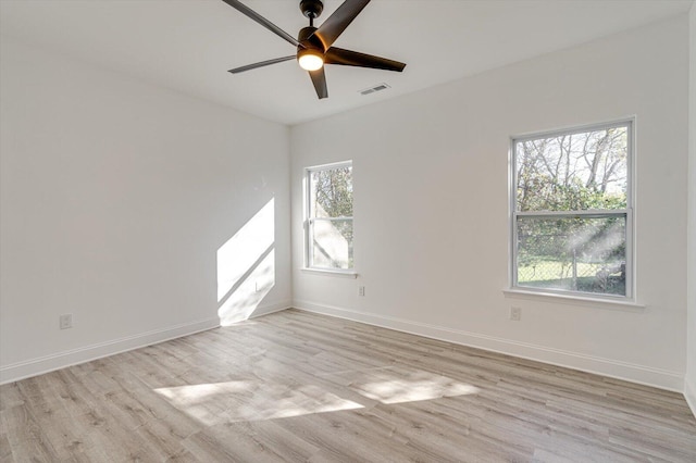 unfurnished room featuring ceiling fan, a healthy amount of sunlight, and light hardwood / wood-style floors