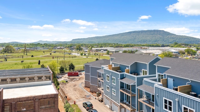 birds eye view of property with a mountain view