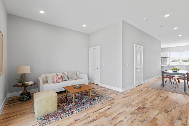 living room with light hardwood / wood-style floors