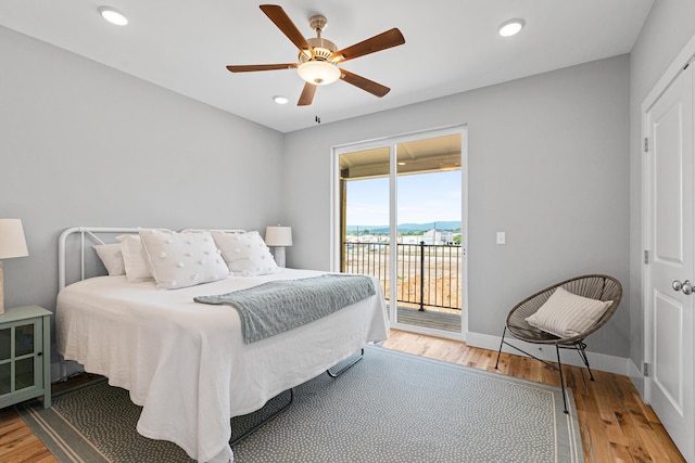 bedroom featuring ceiling fan, access to outside, and light hardwood / wood-style flooring