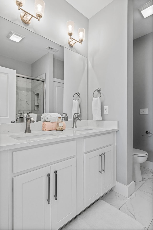 bathroom featuring toilet, an enclosed shower, and vanity