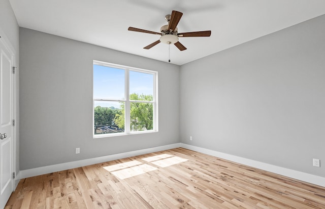 unfurnished room with light wood-type flooring and ceiling fan