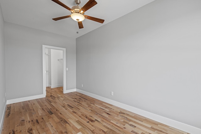 empty room featuring ceiling fan and light wood-type flooring