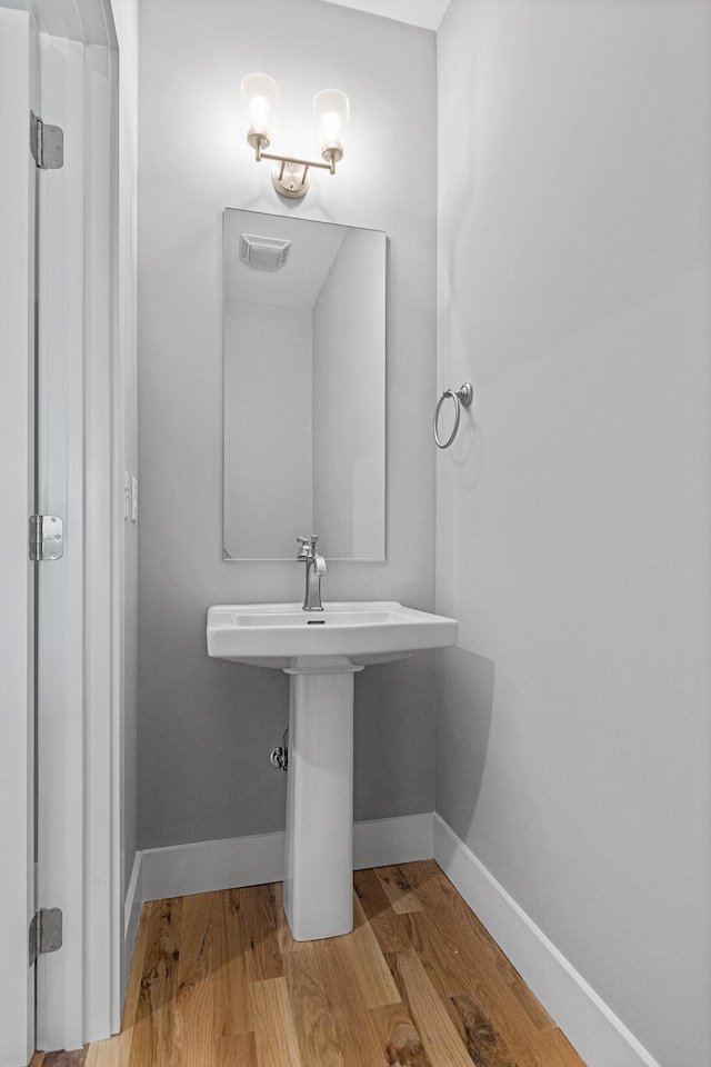 bathroom featuring wood-type flooring