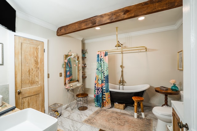 bathroom featuring a bathtub, toilet, crown molding, and vanity