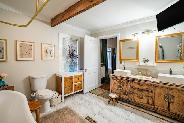 bathroom featuring toilet, beamed ceiling, ornamental molding, vanity, and a bathtub