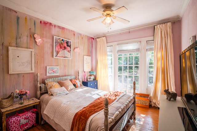 bedroom featuring ornamental molding, wood-type flooring, and ceiling fan