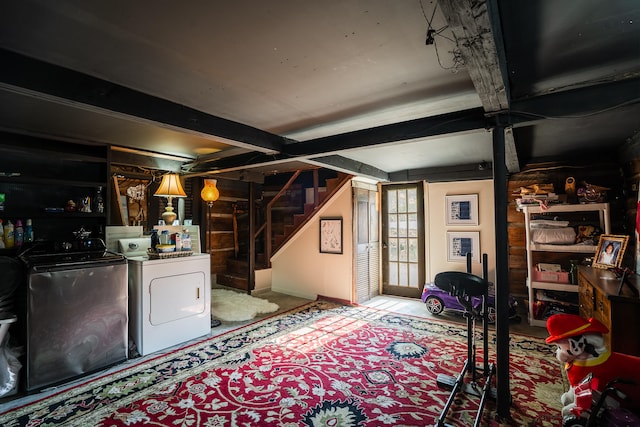 basement featuring washing machine and dryer and carpet flooring