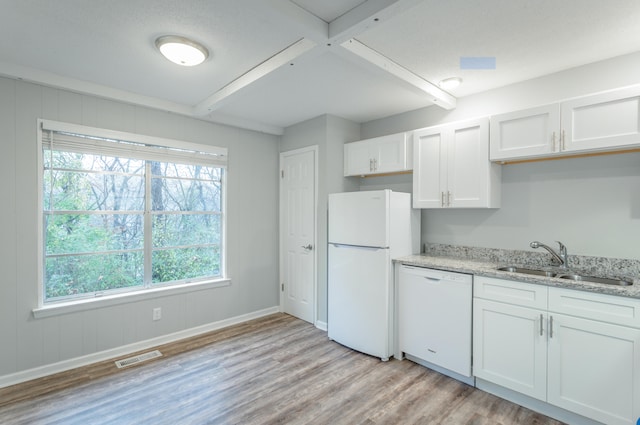 kitchen with white cabinetry, white appliances, sink, and light hardwood / wood-style floors