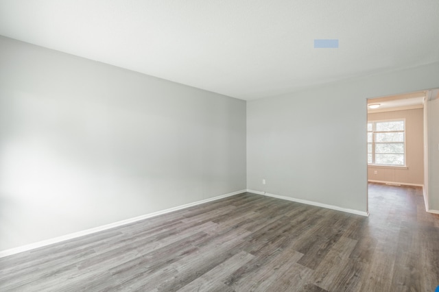 empty room featuring hardwood / wood-style flooring