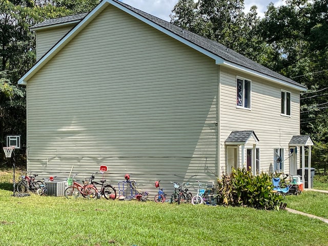 view of property exterior featuring a lawn