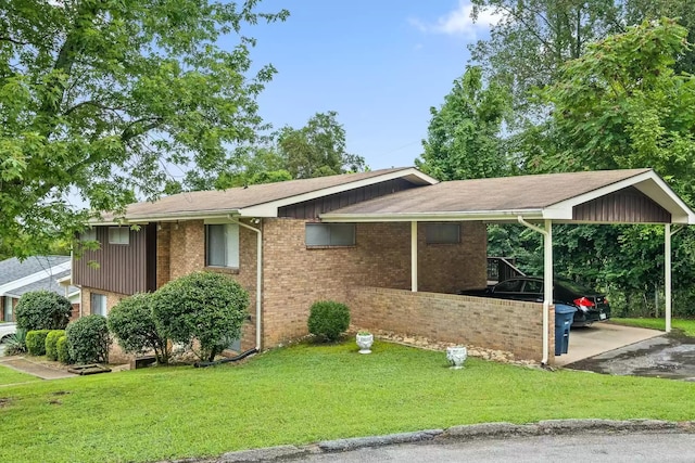 view of front facade with a carport and a front yard