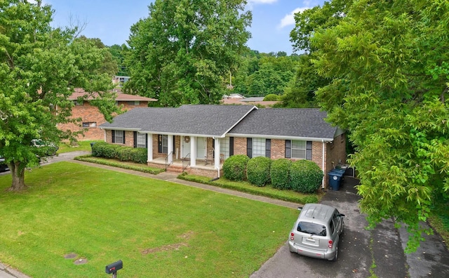 view of front of home with a front lawn and covered porch