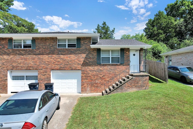 view of front facade with a garage and a front lawn