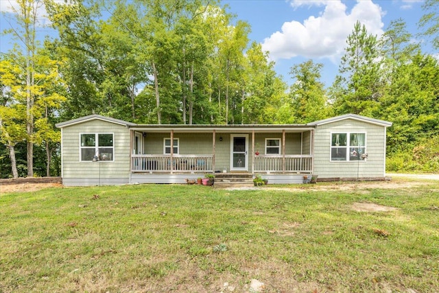 single story home with covered porch and a front yard