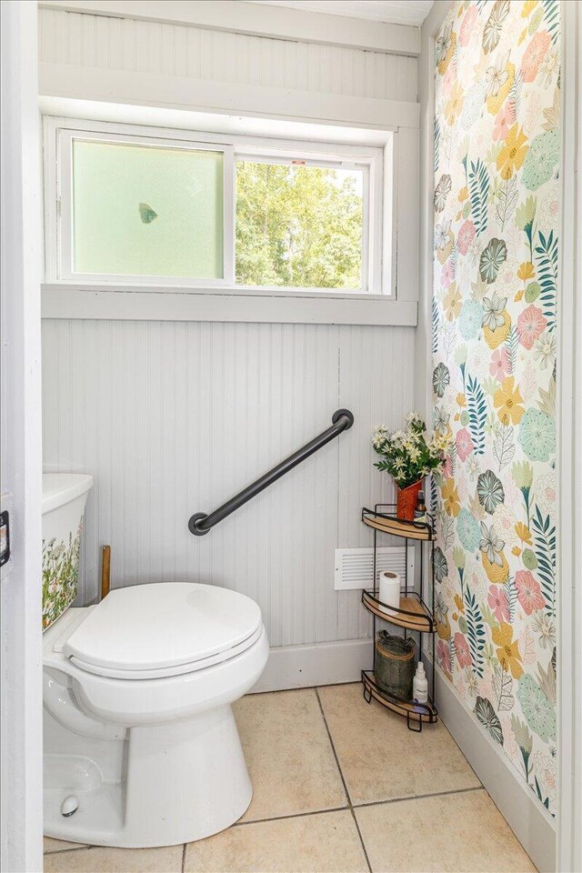 bathroom featuring toilet and tile patterned floors