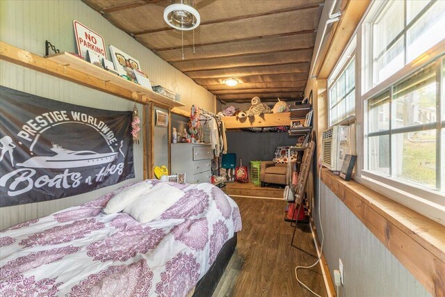 bedroom featuring dark wood-type flooring and cooling unit