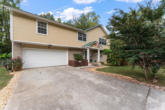 view of front of home featuring a garage and a front lawn