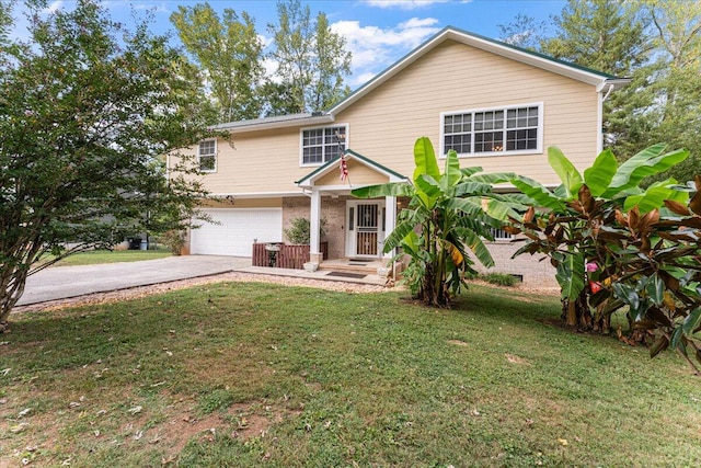 view of front of property featuring a garage and a front lawn