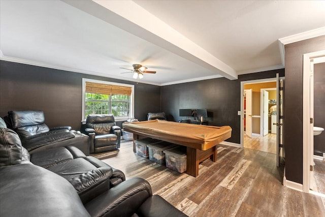 living room with ceiling fan, beamed ceiling, ornamental molding, and wood-type flooring