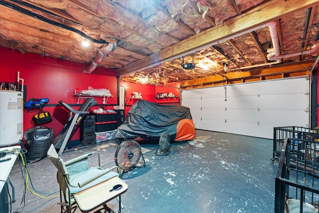 garage with a garage door opener and electric water heater