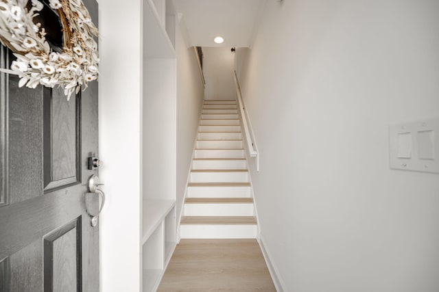 stairway featuring wood-type flooring