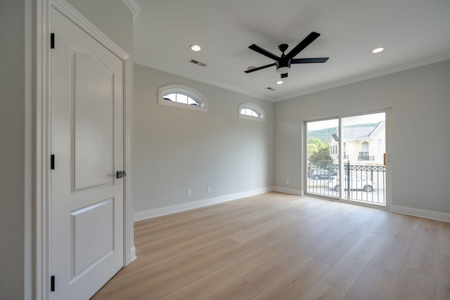 spare room with a healthy amount of sunlight, ceiling fan, ornamental molding, and light wood-type flooring