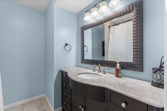 bathroom featuring tile patterned flooring and vanity