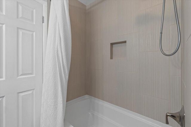 bathroom with shower / tub combo with curtain