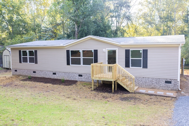 view of front of property with a shed and a front yard