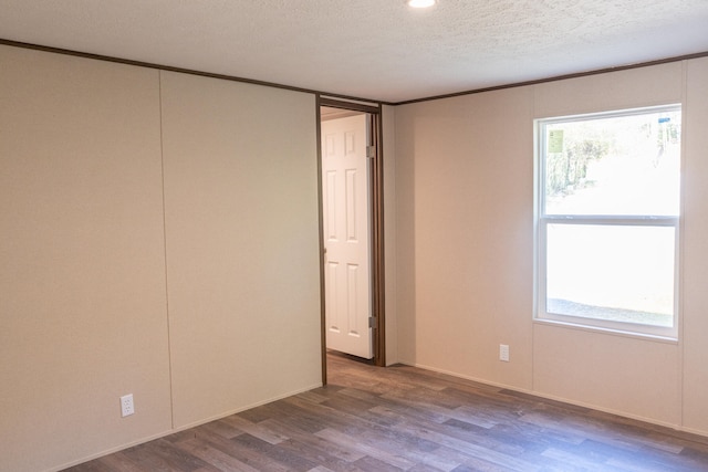 unfurnished bedroom with wood-type flooring and a textured ceiling